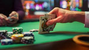 Close-up of live baccarat table with cards and chips